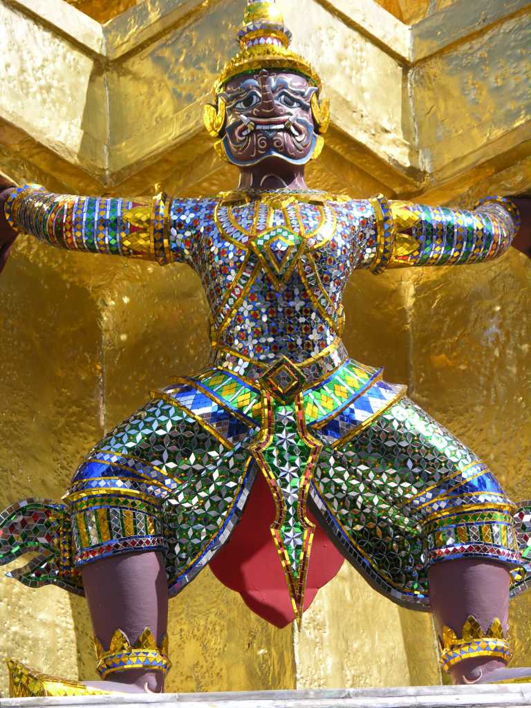 Bangkok 04 03 Wat Phra Kaeo Golden Phra Siratana Chedi Demon Here is the detail of one of the demons supporting the golden chedi at Bangkoks Wat Phra Kaeo.